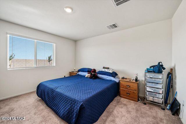 34932 S Iron Jaw Dr, Red Rock, AZ 85145 - carpeted bedroom featuring visible vents