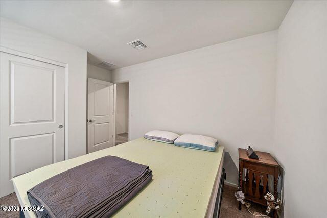 34932 S Iron Jaw Dr, Red Rock, AZ 85145 - bedroom featuring dark colored carpet and visible vents