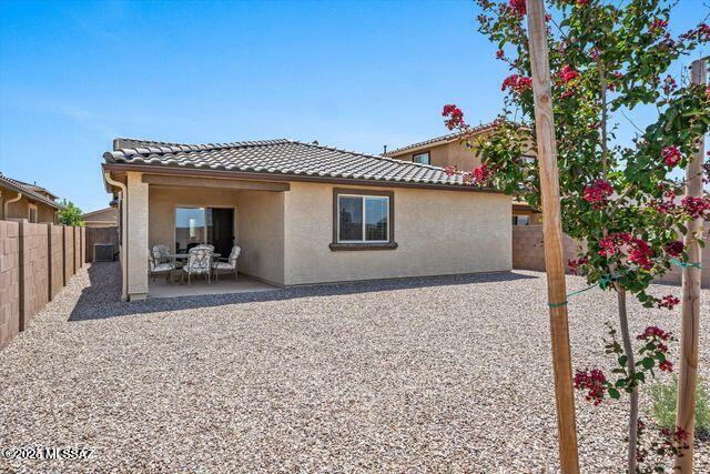 34932 S Iron Jaw Dr, Red Rock, AZ 85145 - rear view of house featuring stucco siding, a patio, a fenced backyard, and a tile roof