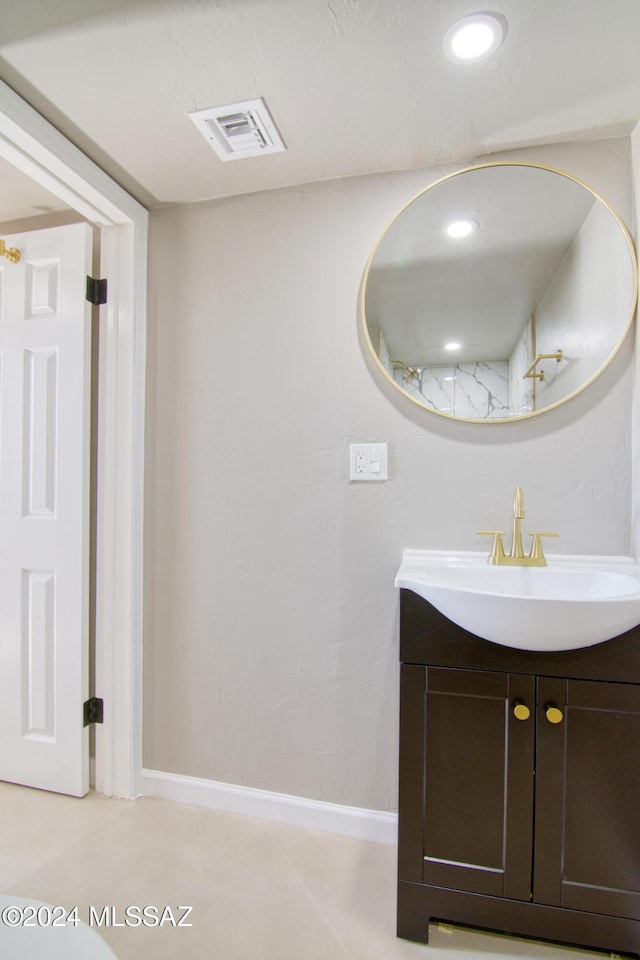 bathroom featuring baseboards, visible vents, recessed lighting, and vanity