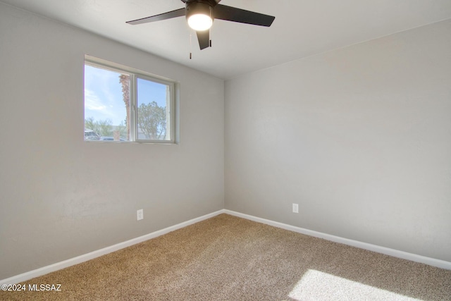 spare room featuring baseboards, carpet floors, and ceiling fan