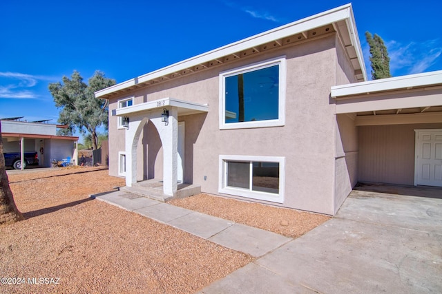 exterior space featuring stucco siding