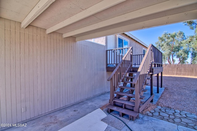 doorway to property featuring fence