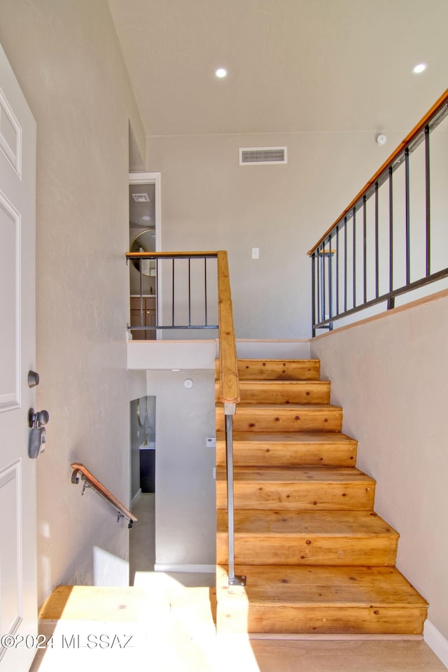 staircase featuring recessed lighting and visible vents