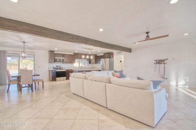 living area featuring recessed lighting, beam ceiling, a ceiling fan, and light tile patterned floors