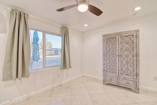 unfurnished room with light tile patterned flooring, baseboards, ceiling fan, and recessed lighting