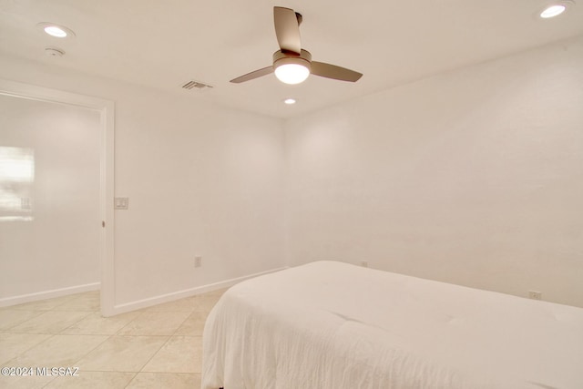 bedroom featuring light tile patterned floors, ceiling fan, baseboards, visible vents, and recessed lighting
