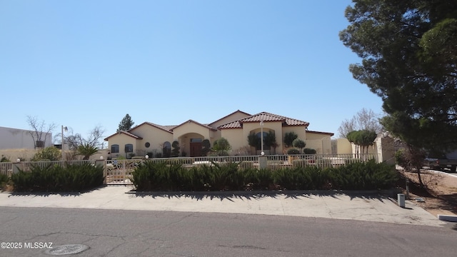 1445 W Fairway Dr, Nogales, AZ 85621 - mediterranean / spanish home with a fenced front yard, a tiled roof, and stucco siding