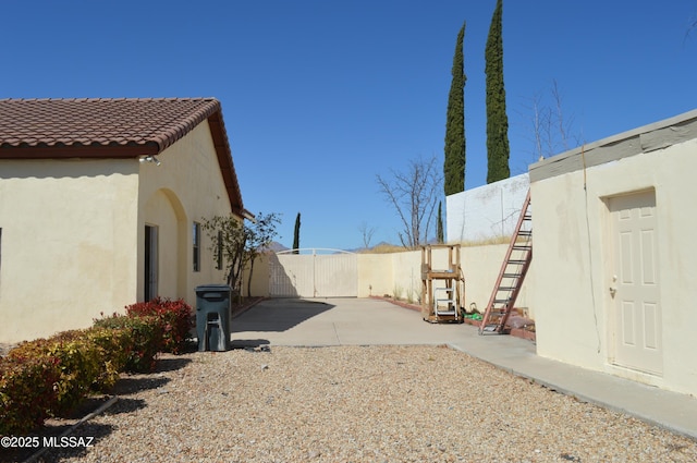 1445 W Fairway Dr, Nogales, AZ 85621 - view of yard featuring a gate, fence, and a patio