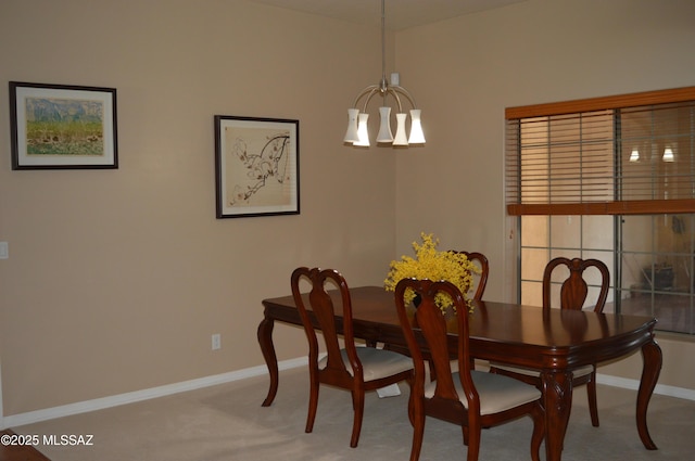 1445 W Fairway Dr, Nogales, AZ 85621 - dining area featuring baseboards, carpet floors, and an inviting chandelier
