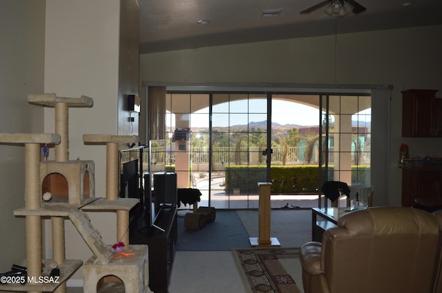 1445 W Fairway Dr, Nogales, AZ 85621 - living area featuring ceiling fan, visible vents, and a mountain view