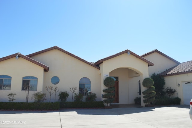 1445 W Fairway Dr, Nogales, AZ 85621 - mediterranean / spanish-style home featuring a tile roof and stucco siding