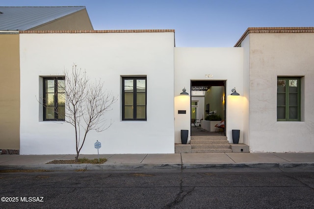 exterior space featuring stucco siding