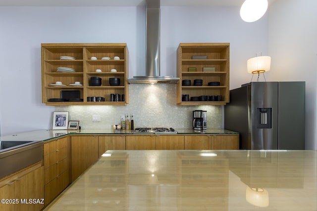 kitchen featuring open shelves, decorative backsplash, appliances with stainless steel finishes, wall chimney range hood, and brown cabinets