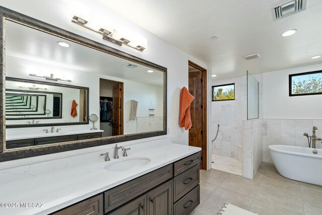 14623 N Shaded Stone Pl, Oro Valley, AZ 85755 - bathroom with a freestanding bath, vanity, visible vents, and walk in shower
