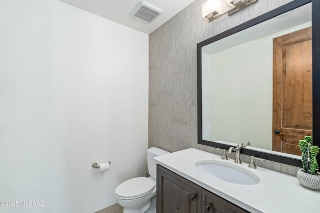 14623 N Shaded Stone Pl, Oro Valley, AZ 85755 - bathroom featuring visible vents, toilet, and vanity