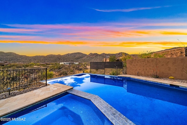 14623 N Shaded Stone Pl, Oro Valley, AZ 85755 - view of pool featuring fence, a pool with connected hot tub, and a mountain view
