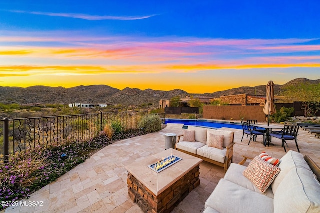 14623 N Shaded Stone Pl, Oro Valley, AZ 85755 - view of patio with an outdoor living space with a fire pit, a mountain view, a fenced in pool, and fence