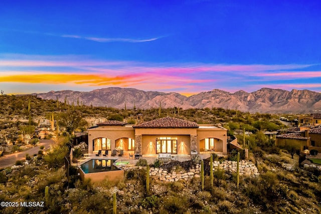14623 N Shaded Stone Pl, Oro Valley, AZ 85755 - rear view of house featuring a tiled roof, a mountain view, a patio, and stucco siding