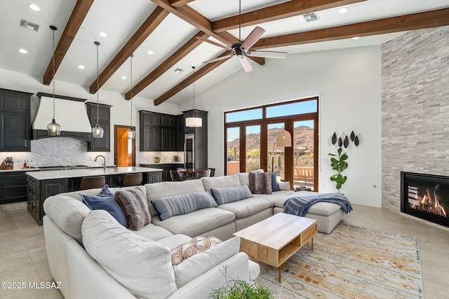 14623 N Shaded Stone Pl, Oro Valley, AZ 85755 - living room featuring high vaulted ceiling, visible vents, beam ceiling, and ceiling fan