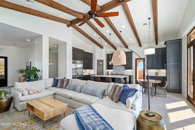 14623 N Shaded Stone Pl, Oro Valley, AZ 85755 - living area featuring beam ceiling, ceiling fan, high vaulted ceiling, and visible vents