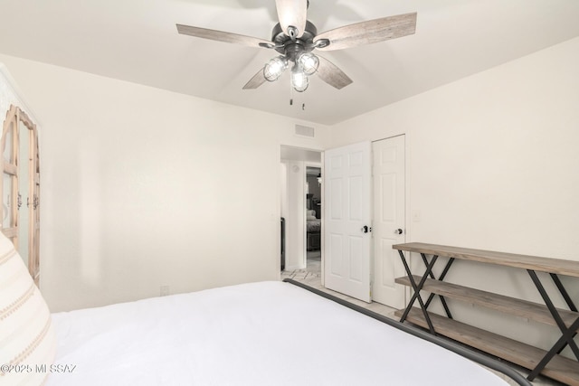 bedroom with visible vents and a ceiling fan