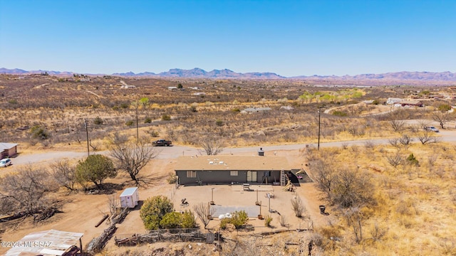 bird's eye view with a mountain view and view of desert