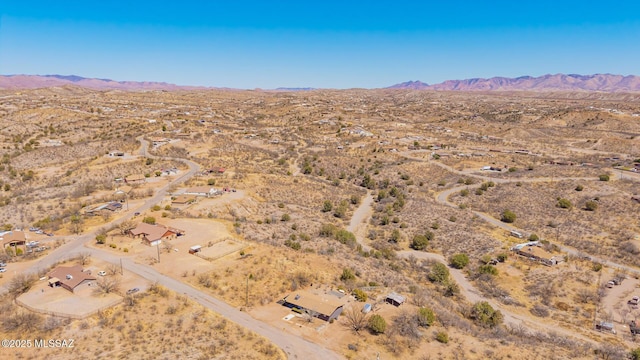aerial view with a mountain view and view of desert