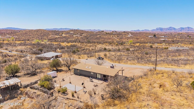 drone / aerial view featuring a mountain view