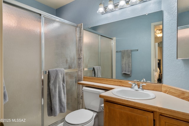 4654 W Gatehinge Ct, Tucson, AZ 85741 - bathroom with vanity, toilet, and a stall shower