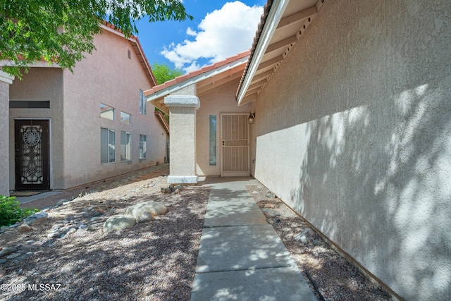 4654 W Gatehinge Ct, Tucson, AZ 85741 - doorway to property featuring stucco siding