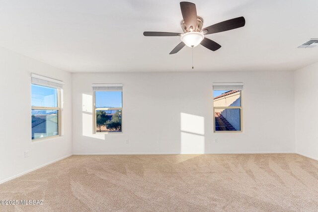 6866 E Via Arroyo Largo, Tucson, AZ 85756 - unfurnished room with carpet flooring, baseboards, and a ceiling fan