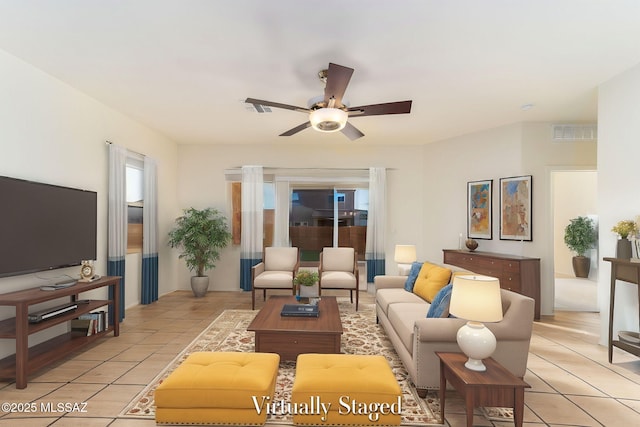 6866 E Via Arroyo Largo, Tucson, AZ 85756 - living room featuring light tile patterned floors and a ceiling fan