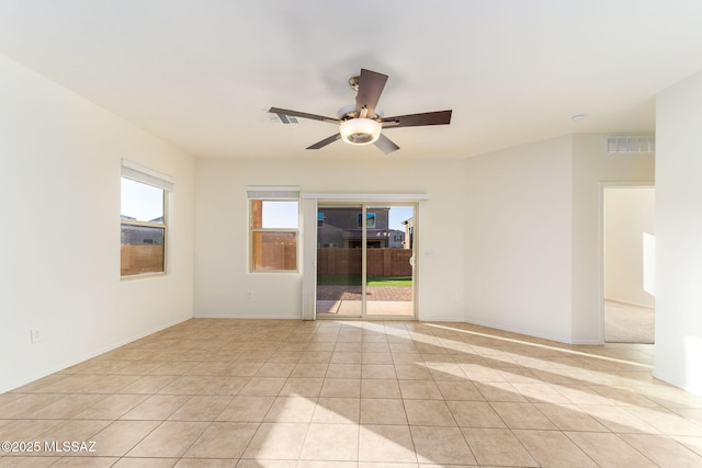 6866 E Via Arroyo Largo, Tucson, AZ 85756 - spare room with a ceiling fan, light tile patterned floors, and baseboards