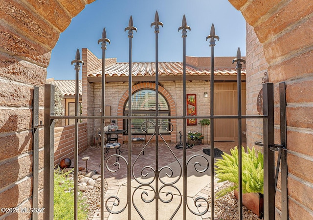 view of gate with fence