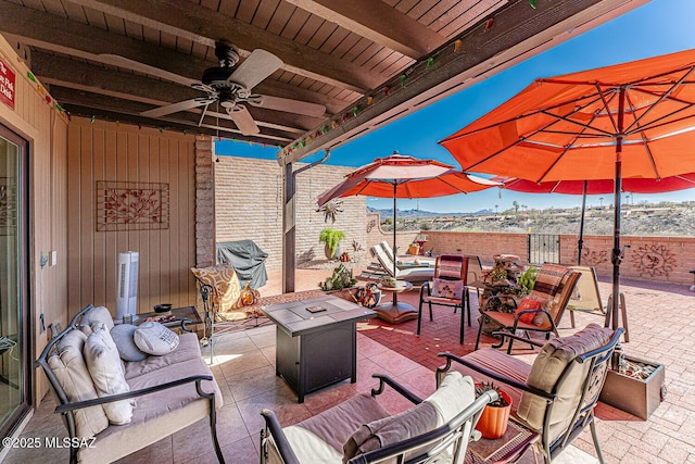 view of patio / terrace featuring an outdoor living space and a ceiling fan