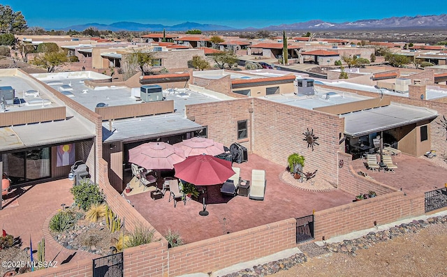 drone / aerial view with a residential view and a mountain view