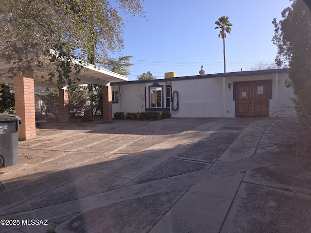 view of front of house featuring stucco siding