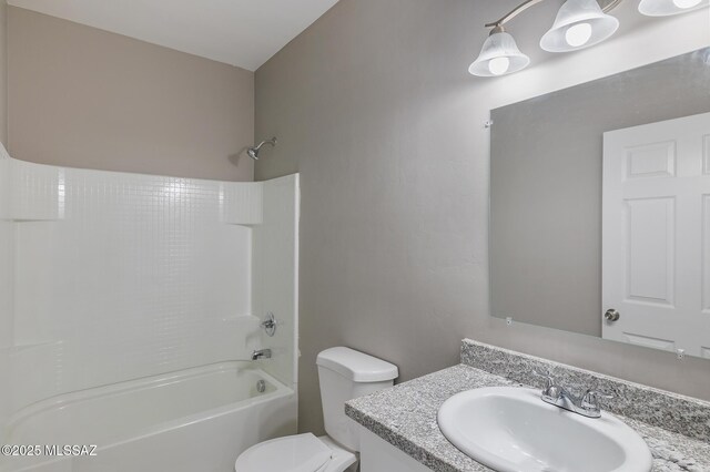 9121 W Claude St, Tucson, AZ 85735 - bathroom featuring shower / bathing tub combination, toilet, and vanity