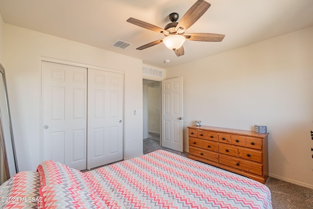 carpeted bedroom featuring a ceiling fan, baseboards, a closet, and visible vents