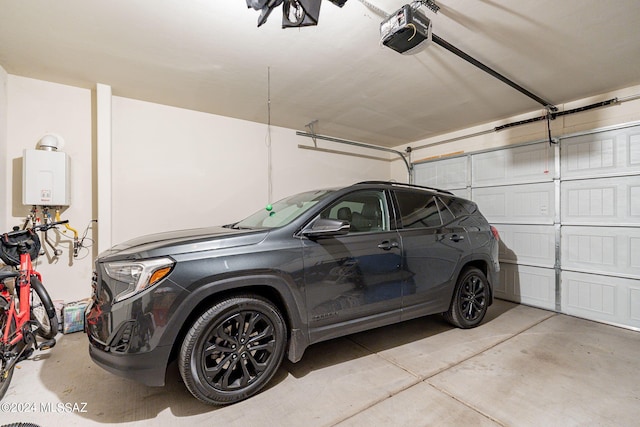 garage featuring tankless water heater and a garage door opener