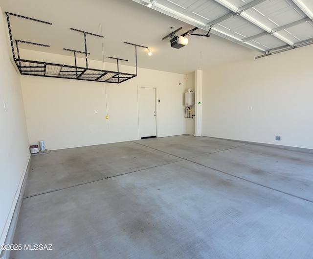 garage featuring water heater and a garage door opener