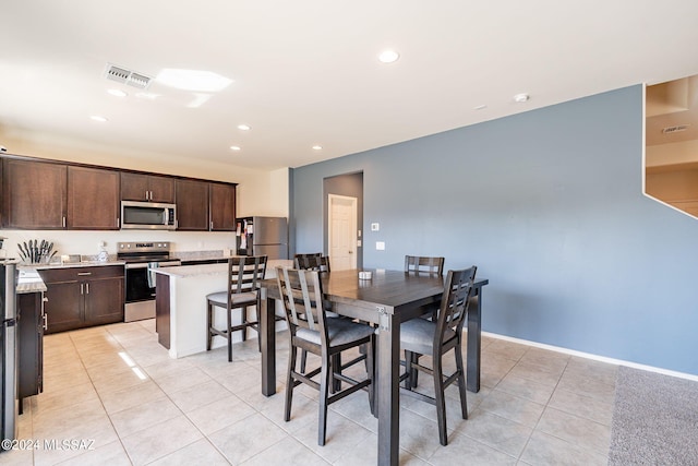 dining area with baseboards, visible vents, recessed lighting, and light tile patterned floors