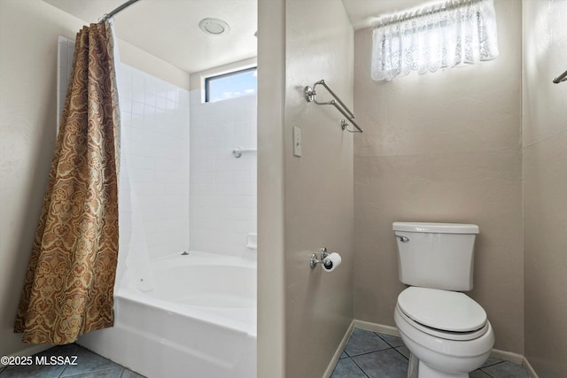 bathroom with shower / bath combination with curtain, tile patterned floors, toilet, and baseboards