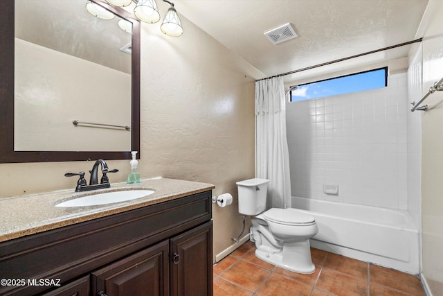 bathroom featuring visible vents, toilet, tile patterned floors, vanity, and shower / tub combo