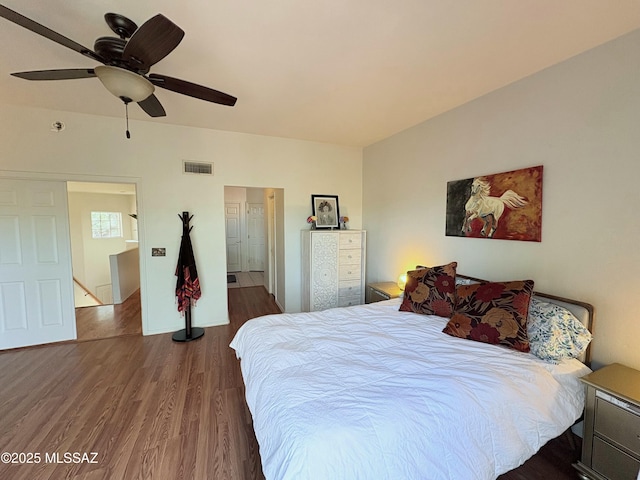 bedroom featuring visible vents, ceiling fan, and wood finished floors