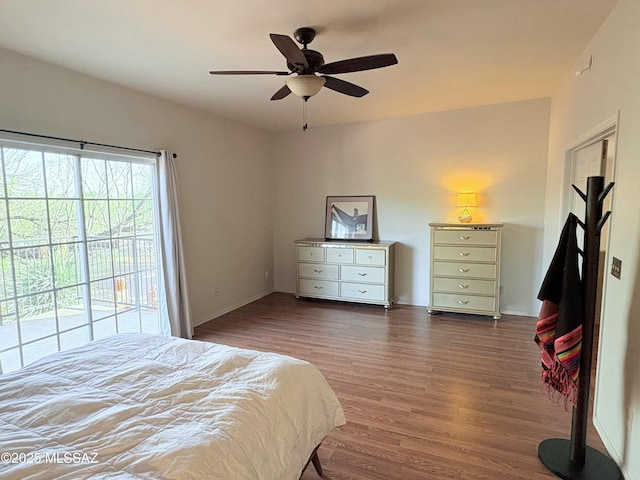bedroom with access to outside, ceiling fan, and wood finished floors