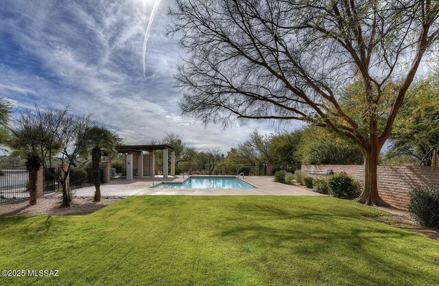 view of pool featuring a fenced in pool, a patio, fence, and a lawn