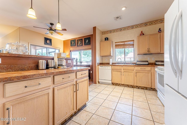kitchen featuring light tile patterned flooring, light brown cabinetry, white appliances, visible vents, and ceiling fan