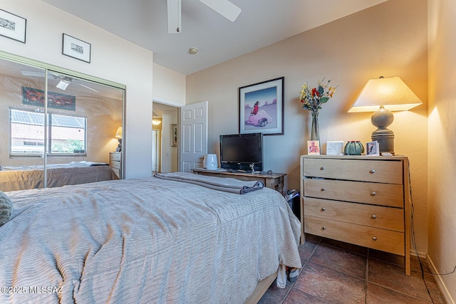 bedroom with baseboards, a closet, and ceiling fan